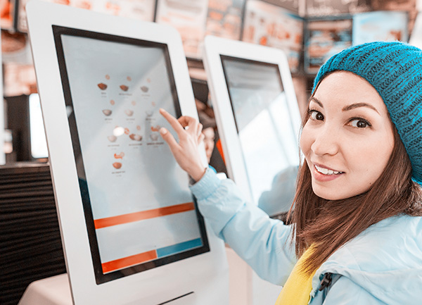 Woman with Interactive Kiosk